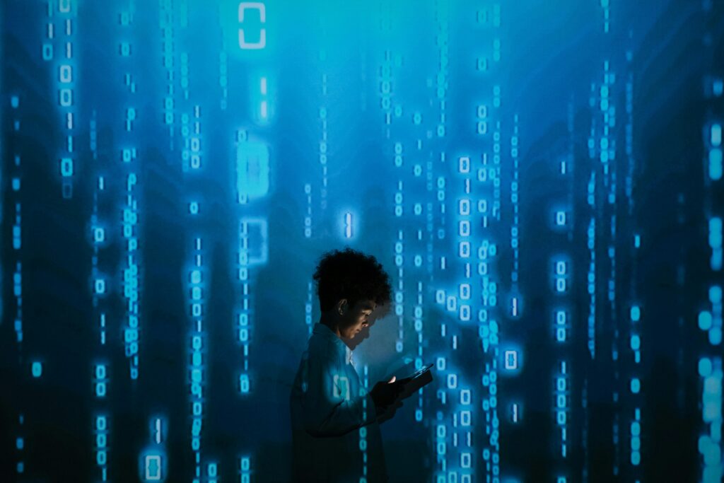 Passive Income Ideas for Beginners – AI Tech Visual Person using smartphone surrounded by binary code, representing passive income ideas for beginners using AI